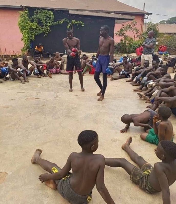 An outdoor training session with young boxers in Uganda